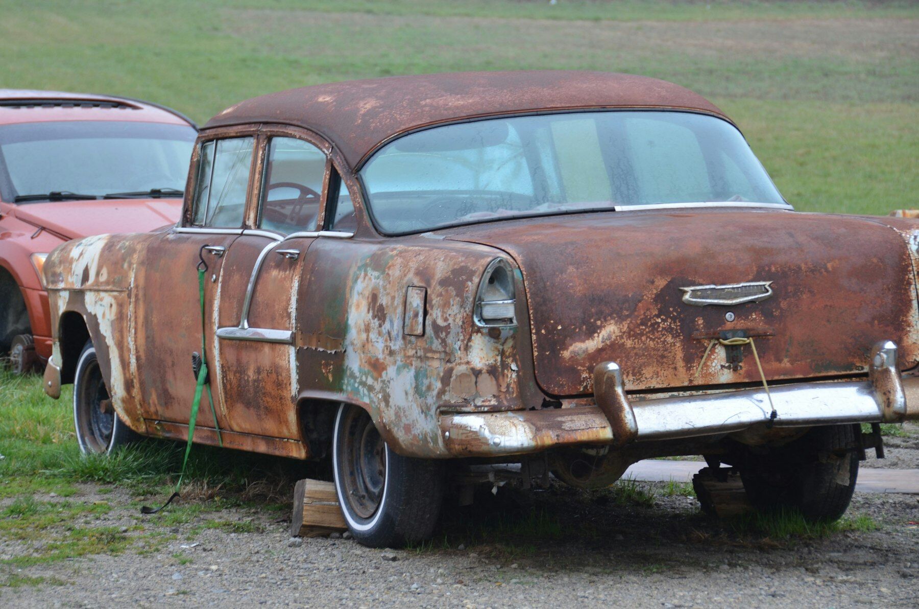 Old rusty scrap car bought for cash in the GTA