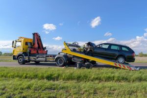 How Junk Car Removal Works in Toronto Toronto junk car removal process - tow truck picking up scrap vehicle